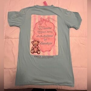 Simply Southern Light Blue Tee with Pink Graphic. Size Medium
